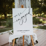 Elegant Black & White Engagement Party Welcome Poster<br><div class="desc">Modern Calligraphy We're Engaged Engagement Party Foam Board</div>