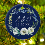 Elegant Blue Floral Wedding Monogram Christmas Ceramic Ornament<br><div class="desc">Bold navy blue and white peony floral monogram Christmas ornament keepsake gift for a modern couple who is newly married. An elegant botanical wreath of green leaves unfolds around trendy handwritten white initials of the bride and groom for a commemorative first Christmas present.</div>