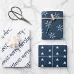 Elegant Blue Ivory Merry Christmas Wrapping Paper Sheets<br><div class="desc">An elegant set of three coordinating wrapping paper sheets in a deep blue and ivory color palette. One has Merry Christmas written in a modern handwritten font.  The second features an abstract Christmas tree pattern and the third sheet has a snowflake pattern.</div>
