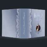 Elegant Blue Wedding Photo Album Binder<br><div class="desc">Romantic wedding album binder done in a elegant light blue damask background. Graphic artwork of a lovely flourish left side, wraps around to the backside of the binder. A light blue bow and a dangling ornate round photo frame decorates the front. Text, on the spine, and photo are ready to...</div>