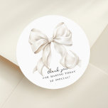 Elegant Bow Bridal Shower Gift Classic Round Sticker<br><div class="desc">"She's tying the knot" theme bridal shower favor bag with an elegant white bow design. Perfect for gift tag or envelope seal as well</div>