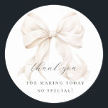 Elegant Bow Bridal Shower Gift Classic Round Sticker<br><div class="desc">"She's tying the knot" theme bridal shower favor bag with an elegant white bow design. Perfect for gift tag or envelope seal as well</div>