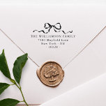 Elegant Bow Merry Christmas Family Return Address Rubber Stamp<br><div class="desc">Return address stamps make sending mail so much easier, especially over Christmas! This rubber stamper features elegant bow and ribbon with your family name and contact details in a classic serif typeface. Make your own via the ¨¨Personalize´´ button. For more advanced changes (like fonts and placement), select "Click to customize...</div>