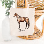 Elegant Brown Horse Equestrian Custom Script Name Tote Bag<br><div class="desc">Personalized elegant Equestrian Horse Riding Tote Bag with Custom Name or Text and a beautiful illustration of a chestnut horse. Show your love for horses while carrying this tote bag or use it to take riding equipment with you. Makes also a great gift for your horse trainer or riding instructor....</div>