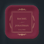 Elegant Burgundy Gold  Wedding Paper Plate<br><div class="desc">Complete your formal event décor with these exquisite personalized paper plates. The opulent design features a deep burgundy hue and a goldish frame, highlighting the names of the couple and their special date. These paper plates are an elegant, convenient solution for serving e.g cake at your wedding reception, rehearsal dinner,...</div>