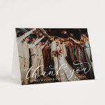 Elegant Calligraphy Custom Wedding Photo Thank You Card<br><div class="desc">Folded horizontal wedding thank you cards feature an elegant and stylish white calligraphy script text overlay design. Personalize the front with a favorite photo of the bride and groom, as well as a simple sans serif monogram of the couple's names. The back includes a second photo and a custom thank...</div>