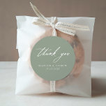 Elegant Calligraphy Sage Green Wedding Thank You Classic Round Sticker<br><div class="desc">Elegant wedding thank you stickers featuring "thank you" displayed in modern white calligraphy with a sage green background. Personalize the sage green wedding thank you stickers with your names and wedding date. The chic wedding thank you stickers are perfect for sealing envelopes, wedding favor bags, and more. Designed to coordinate...</div>