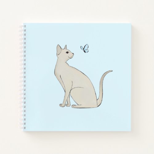 Elegant cat with butterfly notebook