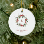 Elegant Christmas Greenery Monogram Family  Ceramic Ornament<br><div class="desc">An elegant christmas greenery monogram initial ornament. This christmas tree ornament features a eucalyptus greenery wreath with red berries and an initial in the middle of the wreath. All text on the card can be customized. There is a photo on the back of the ornament. The photo is for placement...</div>