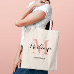 Elegant Coral Pink Custom Wedding Bridesmaid Name Tote Bag<br><div class="desc">Elegant custom wedding tote bag features a personalized monogram typography design with modern calligraphy script name and serif monogram initial in coral / salmon pink and black colors. Includes custom text for a bridal party title like "BRIDESMAID" or other preferred wording.</div>