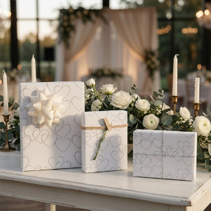 Elegant Decorative Silver Heart Charms on White Wrapping Paper Sheets