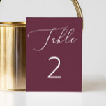 Elegant Deep Burgundy Script Minimalist Wedding Table Number<br><div class="desc">This elegant wedding table number card features a deep burgundy background with delicate script in white, creating a striking contrast that feels both romantic and refined. The rich wine red hue brings warmth and depth to your table decor, making it especially well suited for fall and winter weddings, evening receptions,...</div>