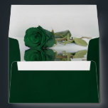 Elegant Deep Emerald Green with Rose Wedding Envelope<br><div class="desc">These beautiful emerald green wedding envelopes are perfect for making your invitations all the more special. They feature a romantic design on the inside flap with a single long stemmed emerald green colored rose reflecting in a pool of water. The back flap has your return address in lacy script calligraphy....</div>