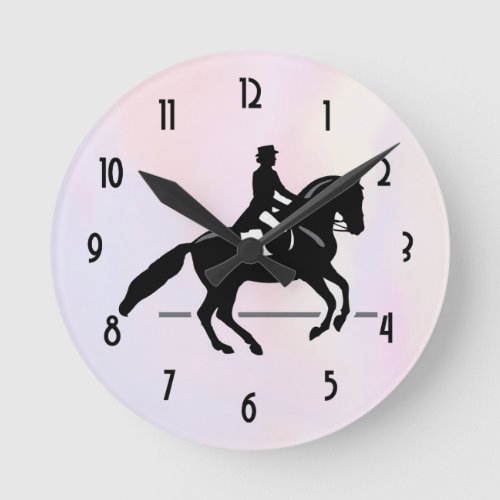 Elegant Dressage Rider on a Watercolor Background Round Clock