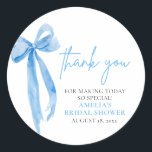 Elegant Dusty Blue Bow Thank you Bridal Shower Classic Round Sticker<br><div class="desc">Express your gratitude in style with our Elegant Dusty Blue Bow Thank You Bridal Shower classic round stickers. These sophisticated stickers feature a delicate dusty blue bow design and elegant script that says "Thank You, " making them perfect for sealing thank-you cards, decorating favor bags, or adding a personal touch...</div>