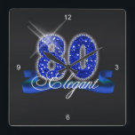 Elegant Eighty Sparkle Square Wall Clock<br><div class="desc">This classy design features a giant,  blue faux-glitter '80',  script text 'Elegant' on a ribbon banner over a black background. Search ID191 to see this design for other ages and on additional products.</div>