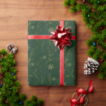 Elegant faux gold green leaves glitter snowflakes wrapping paper<br><div class="desc">Elegant,  faux gold leaves and glitter snowflakes on green background. Minimalist,  modern design</div>