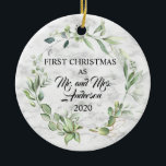 Elegant First Christmas Married Greenery Marble Ceramic Ornament<br><div class="desc">Elegant First Christmas Married Greenery on faux Marble background Ceramic Ornament celebrates the love that a couple shares on their first Christmas together and is truly magical. Set against and elegant marble look background, a wreath of watercolor greenery frames the announcement of "FIRST CHRISTMAS AS Mr. and Mrs and the...</div>