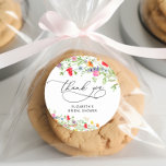 Elegant Floral Bridal Shower Thank You Classic Round Sticker<br><div class="desc">Indulge in the vibrant beauty of our Elegant Floral Bridal Shower Thank You Classic Round Sticker, where a kaleidoscope of hues dances in a celebration of love and nature's splendor. This design is a visual masterpiece, featuring an array of wildflowers painted in lively watercolors that infuse each element with a...</div>