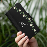 Elegant Floral Daisy Monogram Samsung Galaxy S5 Wallet Case<br><div class="desc">This girly, daisy-themed phone case effortlessly combines modern elegance with a touch of floral charm. Adorned with cute daisy flowers against a sleek black background, it creates a striking yet sophisticated look. Perfect for adding a personalized touch, the case can be monogrammed with your initials, making it uniquely yours. Ideal...</div>
