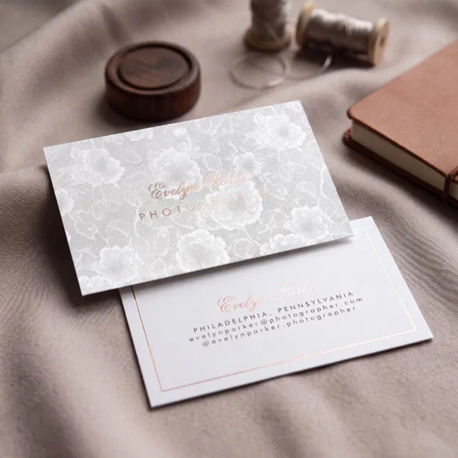 A botanical business card with a delicate, floral design overlaid with rose gold foil typography.