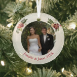 Elegant Floral Wedding Photo Keepsake Christmas Glass Ornament<br><div class="desc">This beautiful custom wedding photograph ornament features a pretty photo of the happy couple and personalized text underneath. Add your own ceremony or first kiss photo for a classy keepsake present you will enjoy every holiday season. Decorated with chic floral sprays on either side of the picture, these elegant Christmas...</div>