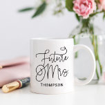 Elegant Future Mrs Calligraphy Name Coffee Mug<br><div class="desc">This gorgeous mug features Future Mrs. in oversized flowing calligraphy script with a custom last name in clean uppercase lettering beneath. The bold, elegant black-on-white design makes a stunning statement for the newly engaged. The last name is fully editable for a personalized keepsake. A beautiful engagement gift, bridal shower present,...</div>
