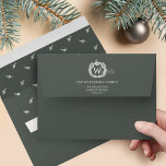 Elegant Garland Wreath Postage Monogram Crest Envelope<br><div class="desc">Deliver the joy this holiday season with our winter garland wreath postage monogram crest holiday envelopes. Our personalized envelopes features our winter garland monogram wreath postage crest design with the inside of envelope featuring an elegant and minimal garland repeat pattern. Customize with family signature, monogram and return address. Spread the...</div>