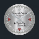 Elegant Garnet Diamonds 1st Wedding Anniversary  Round Clock<br><div class="desc">Opulent elegance frames this 1st wedding anniversary design in a unique scalloped diamond design with center teardrop diamond with heart-shaped sapphire accents and faux added sparkles on a silver-tone gradient. Please note that all embellishments are printed and are only made to appear as real as possible in a flat, printed...</div>
