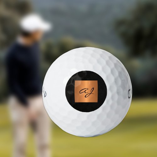Elegant gold black monogram personalized golf balls