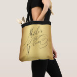 Elegant Gold Black Script Mother of the Groom Tote Bag<br><div class="desc">This elegant personalized typography wedding tote bag for the mother of the groom features a simple calligraphy design of modern black calligraphy script that reads "Mother of the Groom" on a faux gold background with a top border of black. Designed by Susan Coffey.</div>