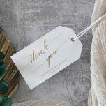 Elegant Gold Calligraphy Thank You Favor Gift Tags<br><div class="desc">These elegant gold calligraphy thank you favor tags are perfect for a fall bridal shower. The neutral design features a minimalist gift tag decorated with romantic and whimsical faux gold foil typography. Personalize these favor labels with the name of the guest of honor, the event and the event date. Please...</div>