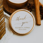 Elegant Gold Calligraphy Thank You Wedding Favor Classic Round Sticker<br><div class="desc">These elegant gold calligraphy thank you wedding favor stickers are perfect for a simple wedding. The neutral design features a minimalist sticker decorated with romantic and whimsical faux gold foil typography. Personalize the sticker labels with your names, the event (if applicable), and the date. These stickers can be used for...</div>