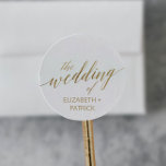 Elegant Gold Calligraphy Wedding Envelope Seals<br><div class="desc">These elegant gold calligraphy wedding envelope seals are perfect for a simple wedding. The neutral design features a minimalist sticker decorated with romantic and whimsical faux gold foil typography. Personalize the label with the names of the bride and groom. Please Note: This design does not feature real gold foil. It...</div>