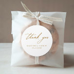 Elegant Gold Calligraphy Wedding Thank You Classic Round Sticker<br><div class="desc">Elegant wedding thank you stickers featuring "thank you" displayed in modern gold calligraphy with a white background. Personalize the gold wedding thank you stickers with your names and wedding date. The chic wedding thank you stickers are perfect for sealing envelopes, wedding favor bags, and more. Designed to coordinate with our...</div>