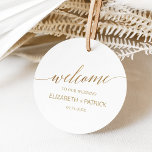 Elegant Gold Calligraphy Wedding Welcome Favor Tags<br><div class="desc">These elegant gold calligraphy wedding welcome favor tags are perfect for a simple wedding. The neutral design features a minimalist round favor tag decorated with romantic and whimsical faux gold foil typography. Personalize the tag with the names of the couple and the wedding date. Please Note: This design does not...</div>