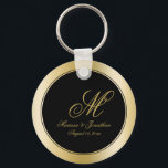 Elegant Gold Monogram Script Black Wedding Keychain<br><div class="desc">These elegant custom wedding key chains will add the perfect touch to your wedding favor gifts. This chic design template features a background of faux gold and black. In the center is the groom's last name monogram initial, bride and groom's first names and wedding date to personalize. Please check out...</div>