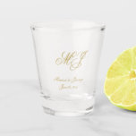 Elegant Gold Monogram Script Wedding Favor Shot Glass<br><div class="desc">These custom monogrammed wedding favor shot glasses feature an elegant faux gold calligraphy script for your monogrammed initials,  names,  and wedding date to personalize. Best of wishes for your wedding and marriage! Designed by Susan Coffey.</div>