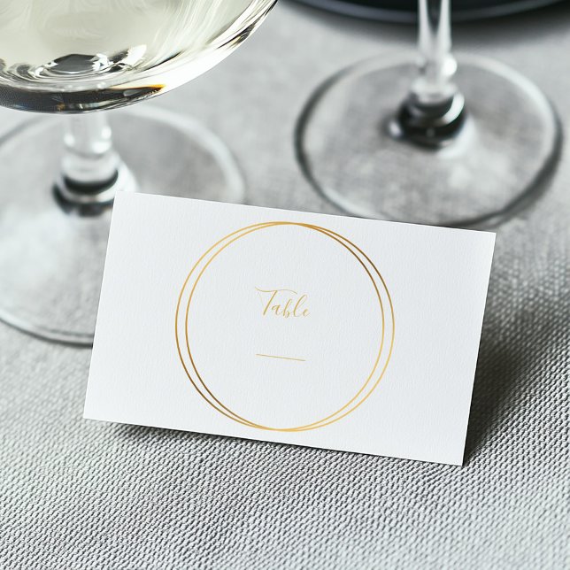 Elegant Gold Rings Table Number Card (Gold rings around elegant text for a wedding reception table number.)