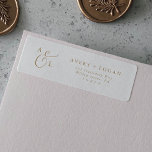 Elegant Gold Script Monogram Return Address Label<br><div class="desc">These elegant gold script monogram return address labels are perfect for a simple wedding. The minimalist gold and white design features fancy romantic typography with modern glam style. Customizable in any color. Keep the design minimal and classy, as is, or personalize it by adding your own graphics and artwork. These...</div>