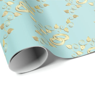 Elegant Gold Wedding Rings on Light Blue Wrapping Paper