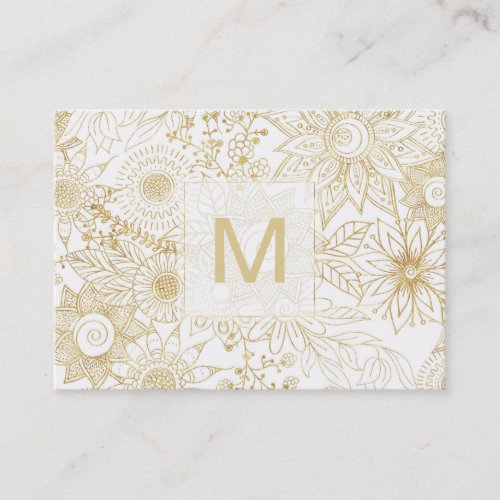 Elegant golden floral doodles design business card