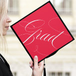 Elegant Grad Calligraphy Script Red Graduation Cap Topper<br><div class="desc">Chic and stylish graduation cap topper featuring "Grad" in a modern calligraphy script against a red background. Change the background color and add text with the Customize tool.</div>