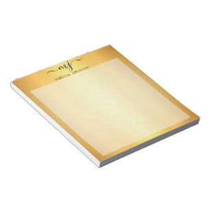 Elegant initials on gold notepad