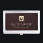 Elegant Leather Luxury Gold Initial Logo Business Card Case<br><div class="desc">Elegant luxury design with brushed metallic gold initial logo medallion with personalized name,  title,  company name or custom text below in classic block typography on an oxblood leather print background. Personalize for your custom use.</div>