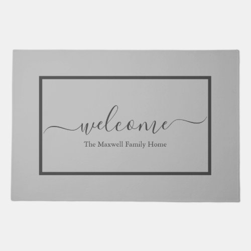 Elegant light gray script family name welcome doormat