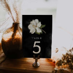 Elegant Magnolia Black and White Wedding Table Number<br><div class="desc">Make a sophisticated statement on your special day with our elegant magnolia wedding table number signs. These signs will add a glamorous touch to your wedding decor. Featuring a white magnolia on a black watercolor background, the table numbers will bring an air of sophistication and style to your tablescapes. Matching...</div>