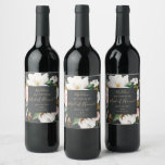 Elegant Magnolia | Black Maid of Honor Proposal Wine Label<br><div class="desc">This elegant magnolia black maid of honor proposal wine label is perfect for a modern classy wedding. The moody floral design features watercolor blush pink peonies, stunning white magnolia flowers and cotton with gold and green leaves in a luxurious arrangement on a dark background. Customize the wine bottle label with...</div>