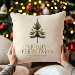 Elegant Merry Christmas Pine Tree Bow Family Throw Pillow<br><div class="desc">Snuggle up in holiday style with our "Merry Christmas" pillow featuring an elegant gold script,  your custom family name and pine tree bow design. Add a festive touch to your home decor while spreading warmth and joy this season! Perfect for cozying up by the fire.</div>