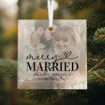 Elegant Merry Married Couple Christmas Glass Ornament<br><div class="desc">If you're looking for a unique and modern Christmas ornament to commemorate your newlywed status, look no further than this custom design. Featuring a photo of the happy couple on their wedding day, a white overlay with a festive typography heart design reading "merry married", and space to personalize with the...</div>
